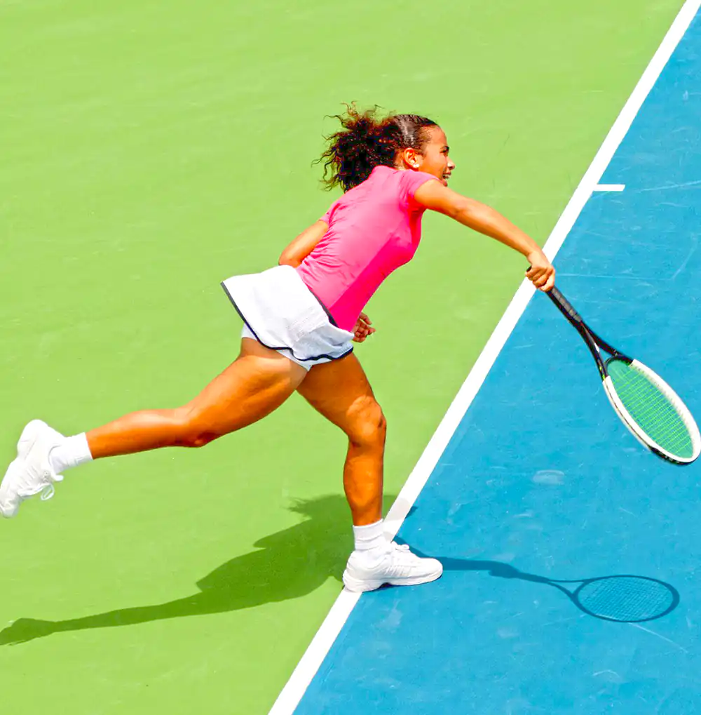 A female playing tennis