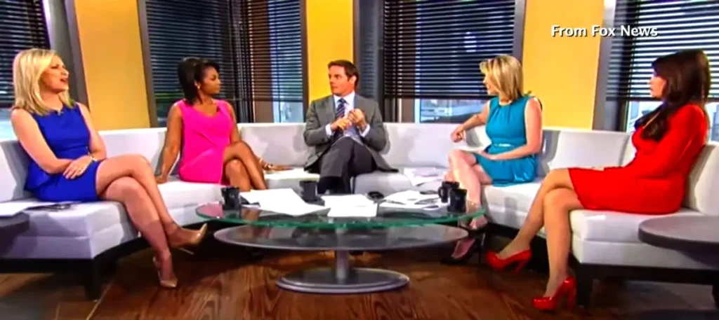 Why do female news anchors wear sleeveless dresses
