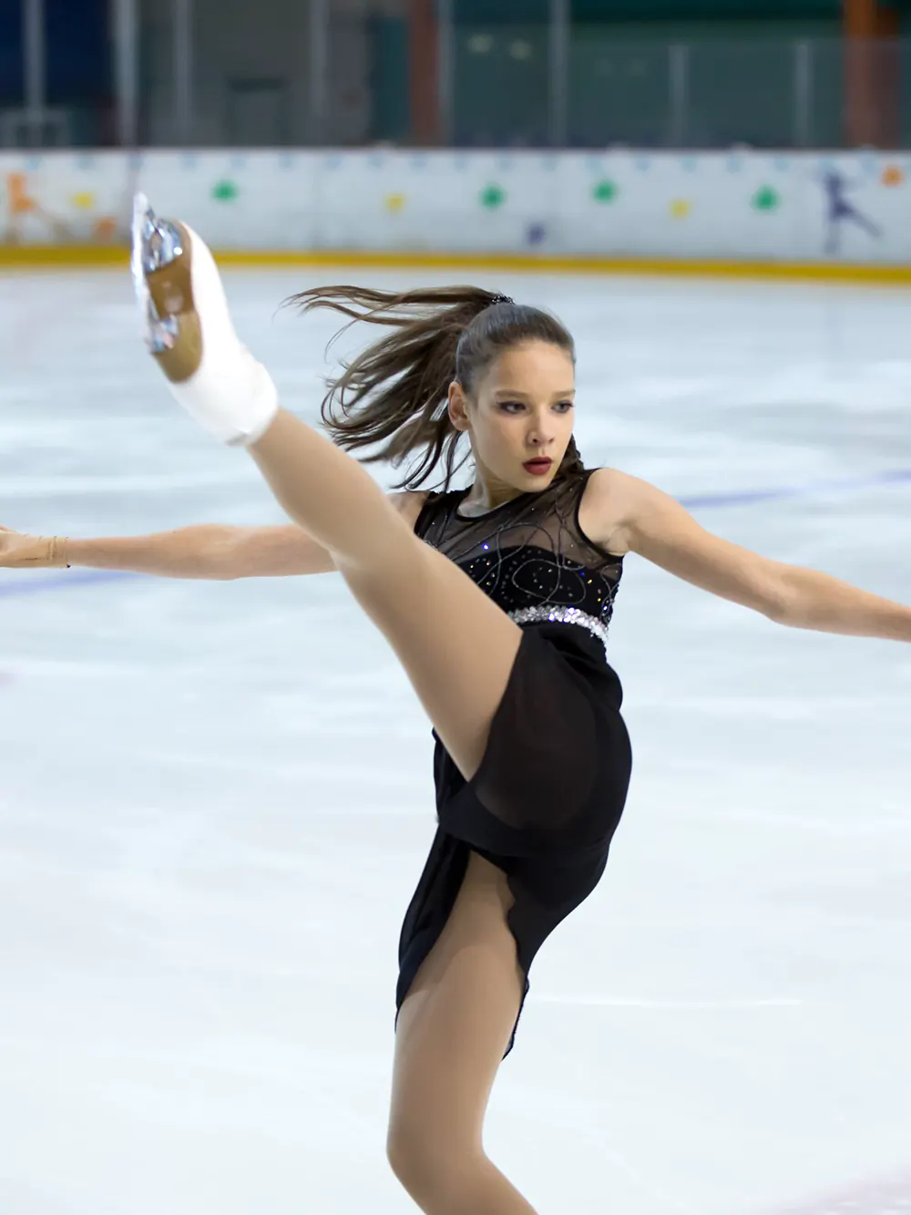 Female figure skaters performing