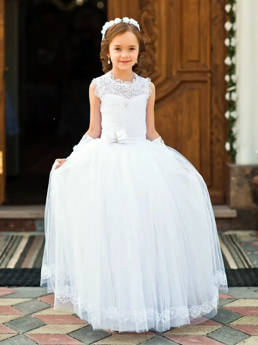 Girl wear white dress for first communion