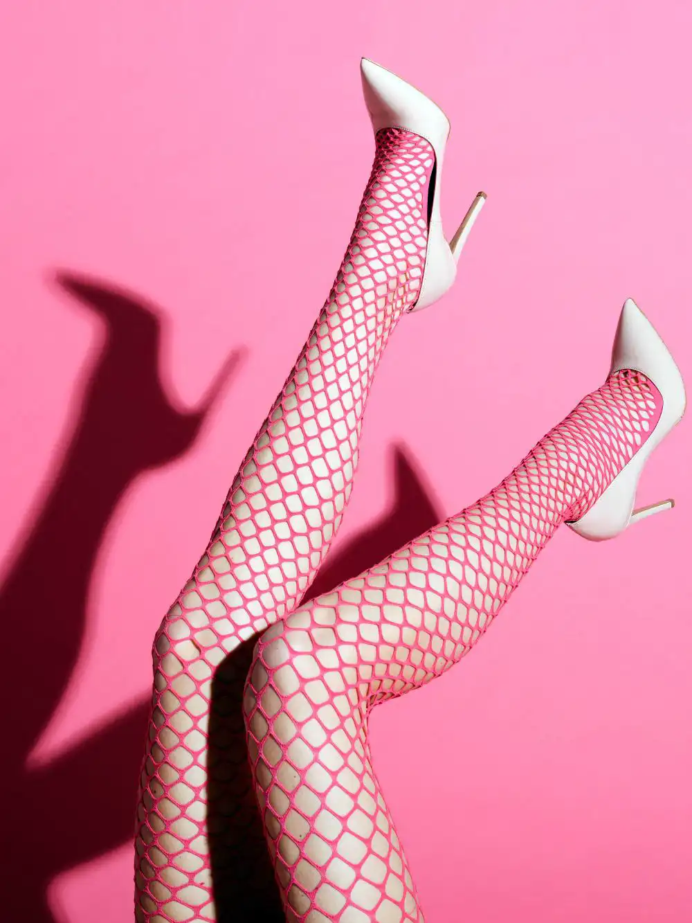 Pink color fishnet stocking legs