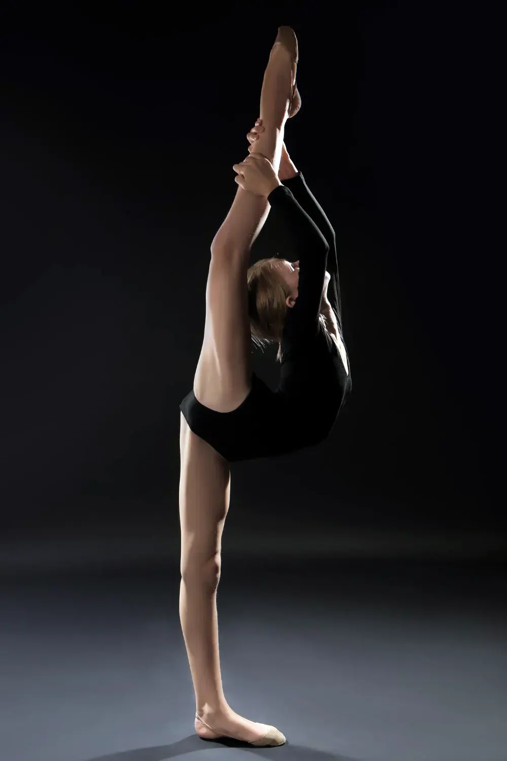 Girl performing gymnastics wearing a leotard