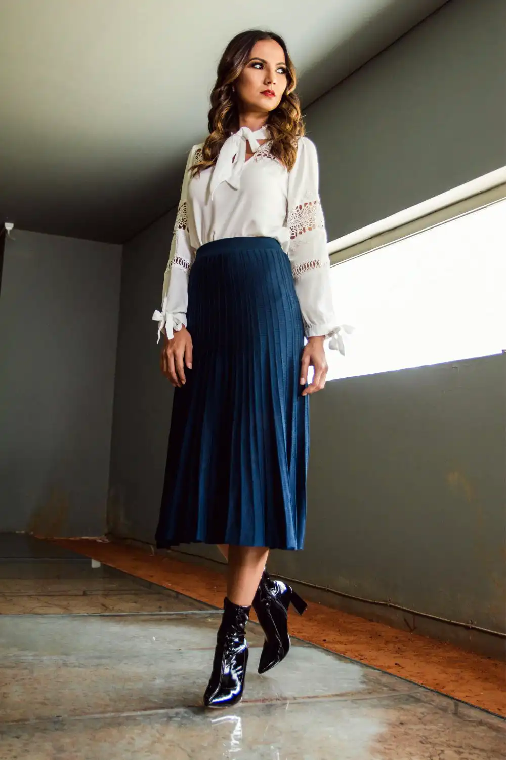 Woman Wearing White Long-sleeved Shirt and Long Blue Skirt