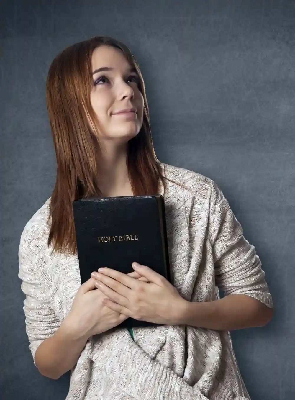 Girl embracing bible