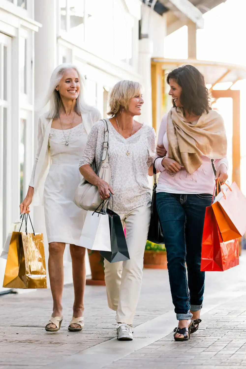 Three mature women shopping