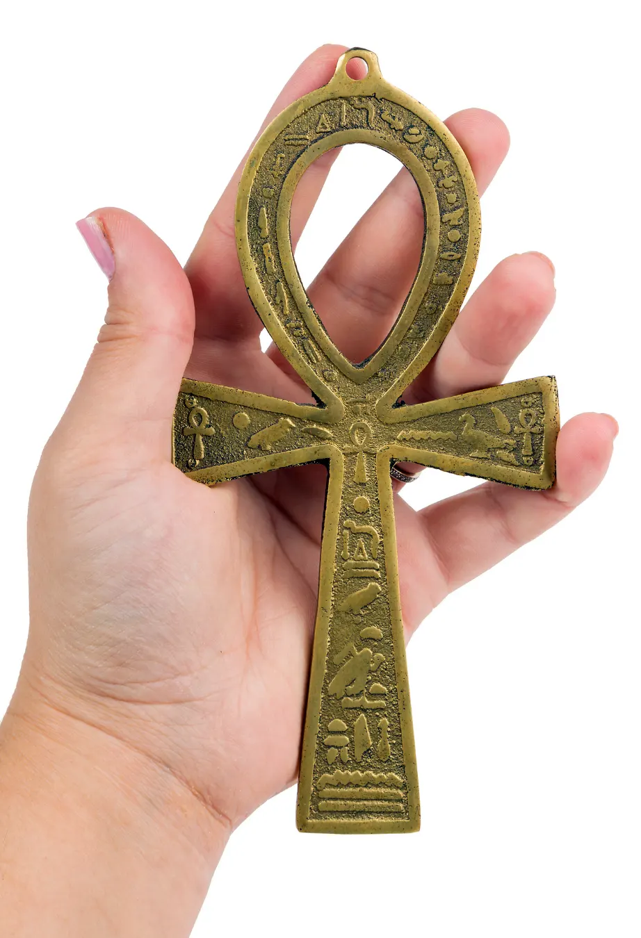 Woman's hand holding egyptian symbol of life Ankh