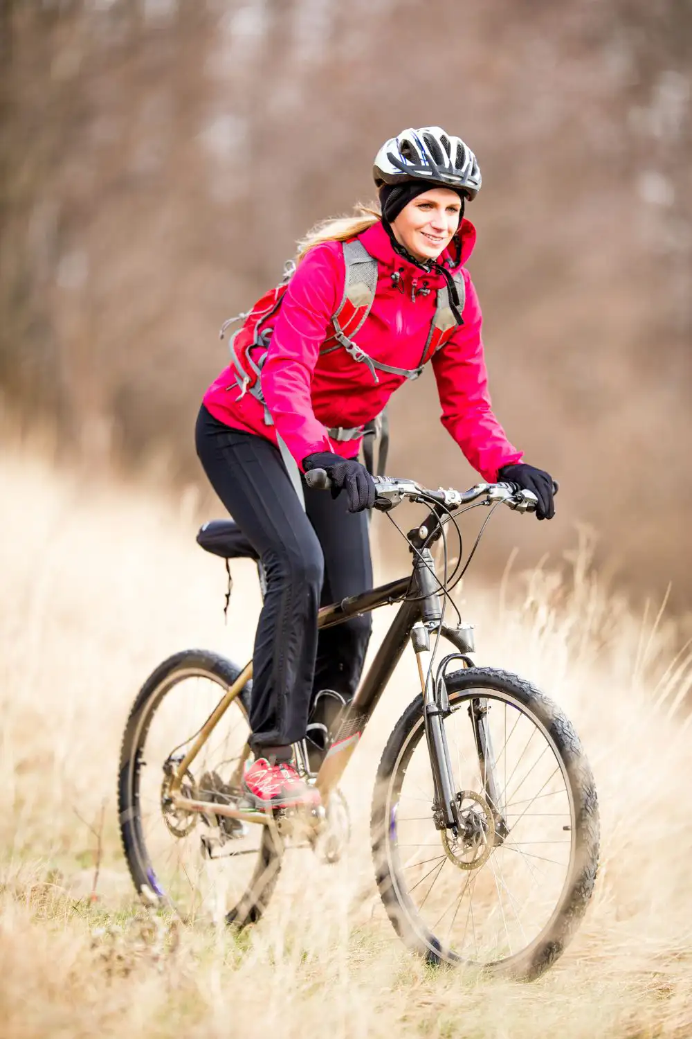 Young Woman Cycling Off Road