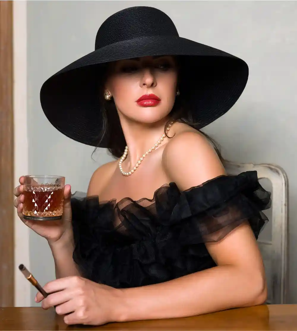 Lady in black hat smoking with drink