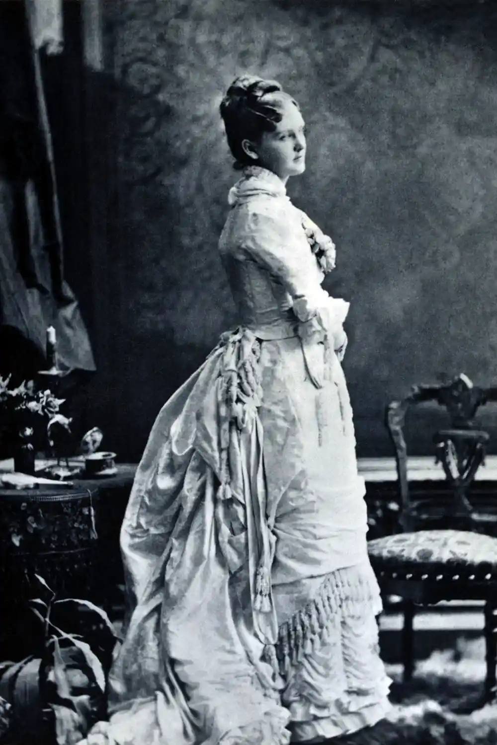 Victorian women wearing bustle dress