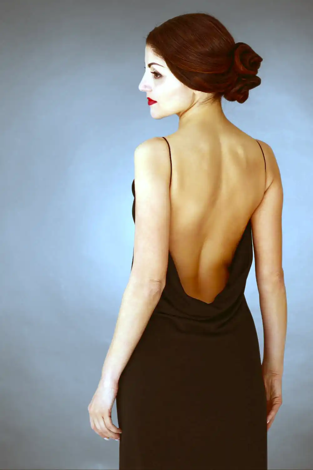 Woman in black backless dress