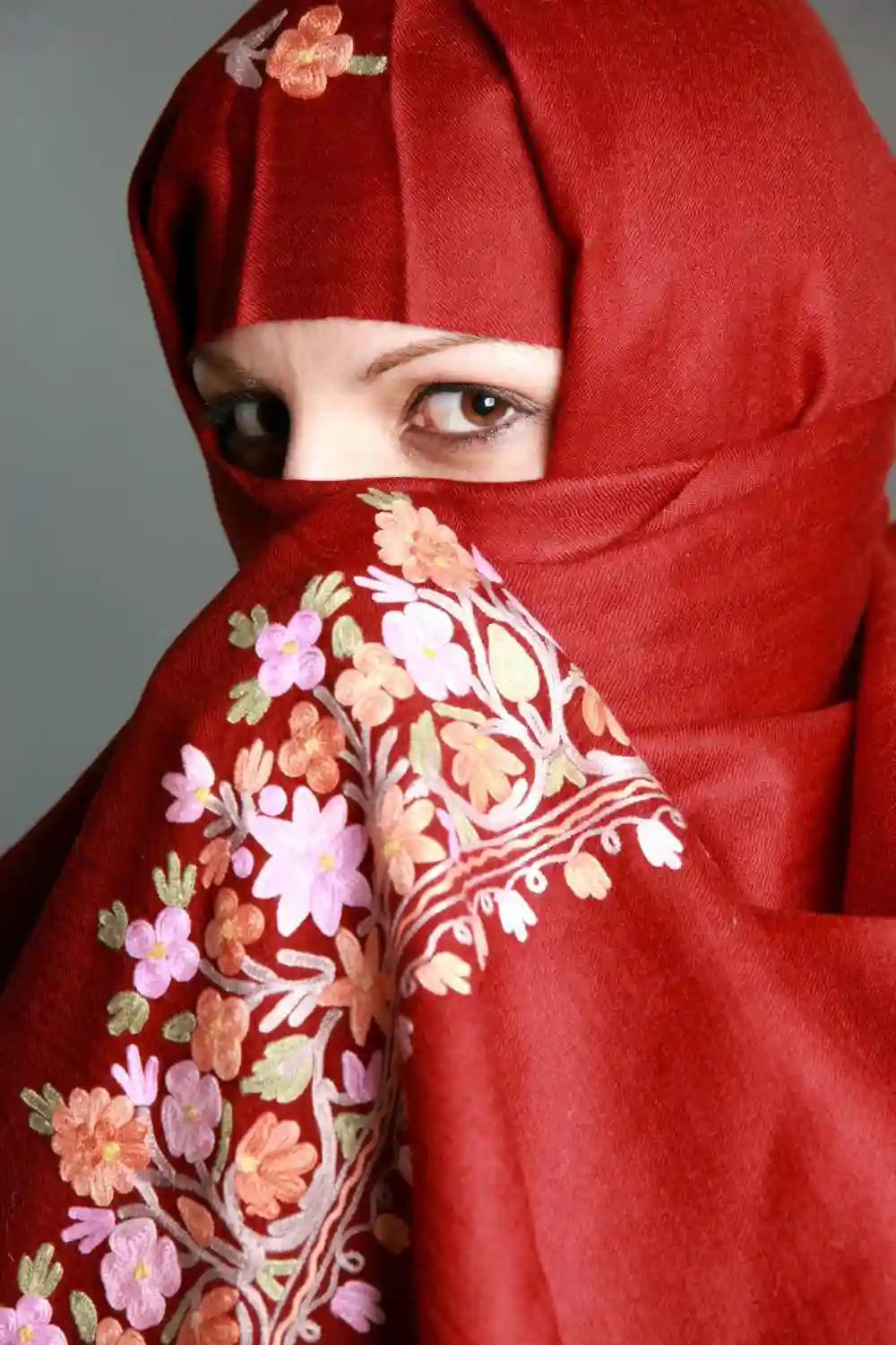 Woman wearing a red veil